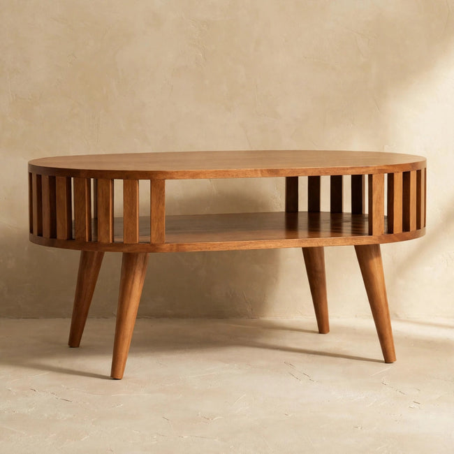 Side view of the honey caramel Ariella coffee table in a living room setting