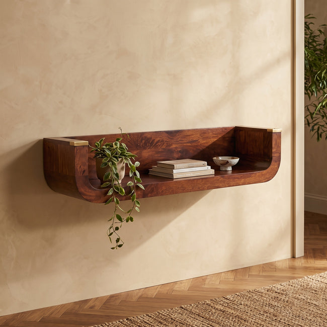 Indira chestnut floating console table mounted on a hallway wall