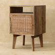 Front view of the woven rattan door on the Knit Door Bedside in a room