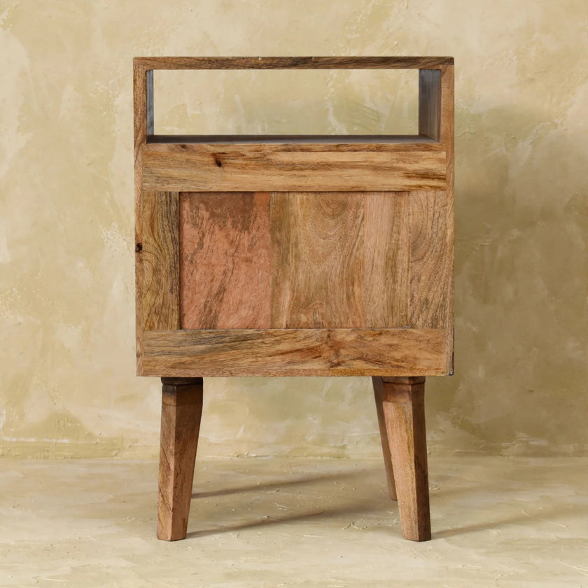 Side view of the bedside table showing its Nordic-style legs and oak-look finish