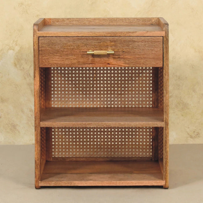 Oak-ish mango wood bedside table styled beside a bed