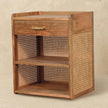 Mango wood bedside table with two open slots in a room setting