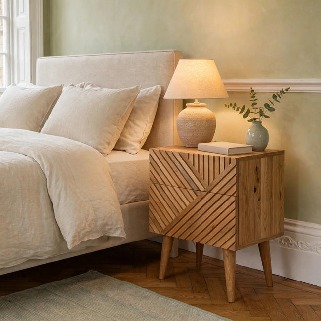 Lille 2 drawer mango wood bedside table with oak-ish finish styled in a bedroom