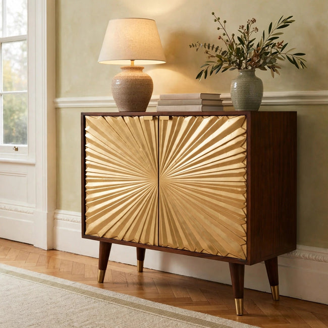 Manila Gold Cabinet in solid mango wood with brass-plated doors, shown in a living room
