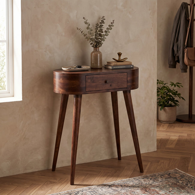 Mini Albion chestnut mango wood console table with one small drawer, shown in a room setting