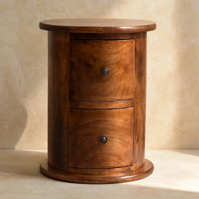 Small round chestnut drum chest with two drawers used as a bedside table