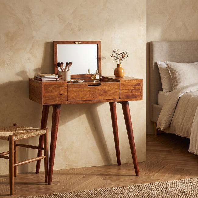 Mini Chestnut Fold Vanity in solid mango wood with its mirror open, shown in a bedroom setting