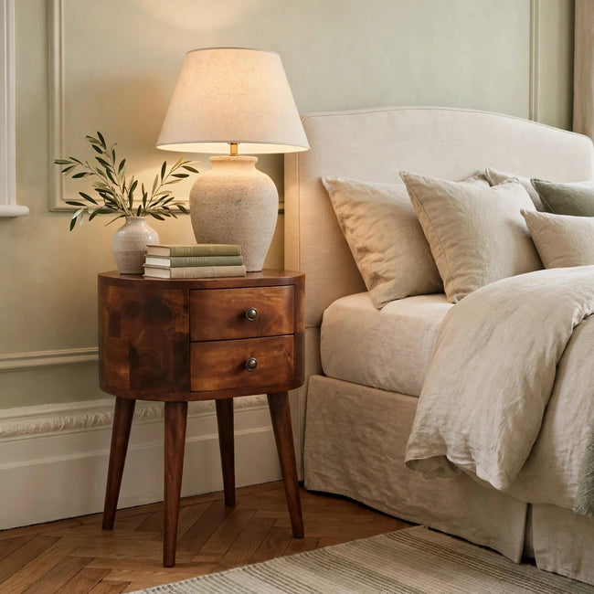 Mini chestnut bedside table in solid mango wood with rounded edges, styled in a bedroom