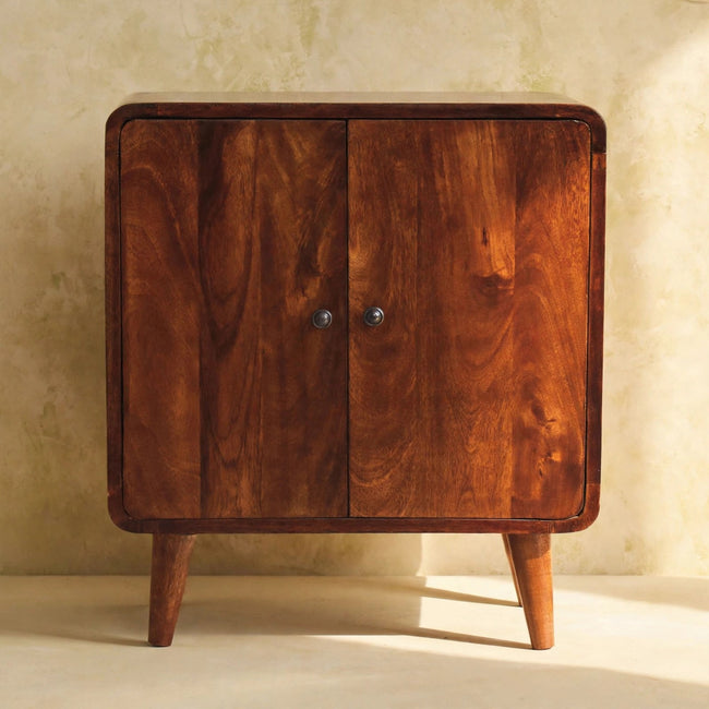 Front view of the chestnut mango wood cabinet with two doors and metal knobs