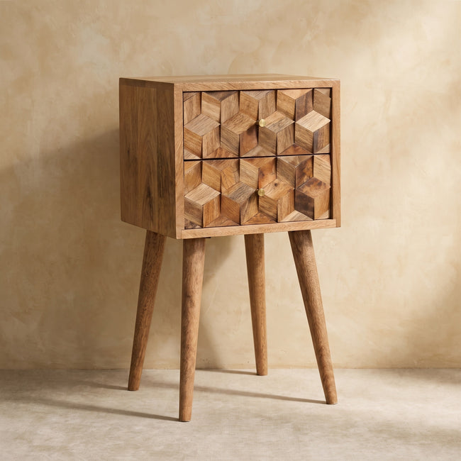 Solid mango wood bedside table with two cube carved drawers and Scandinavian-style legs in a room setting