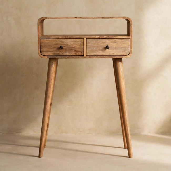 Solid mango wood console table with curved edges and two drawers in a home interior
