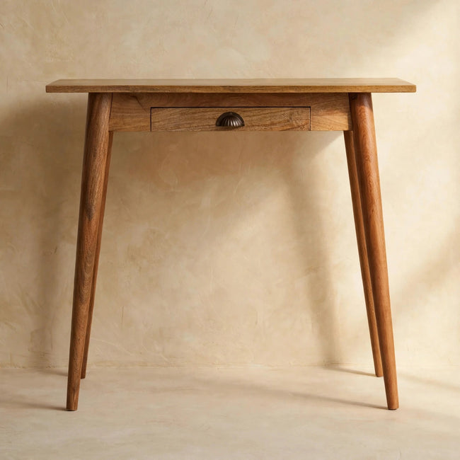 Writing desk with a light oak-ish finish and Nordic style legs in a styled study