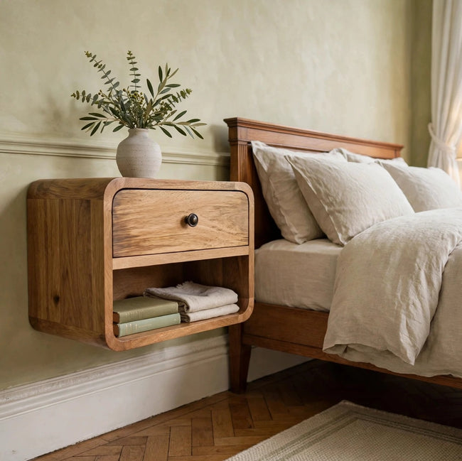 Mini floating bedside table in oak-ish mango wood mounted on a bedroom wall