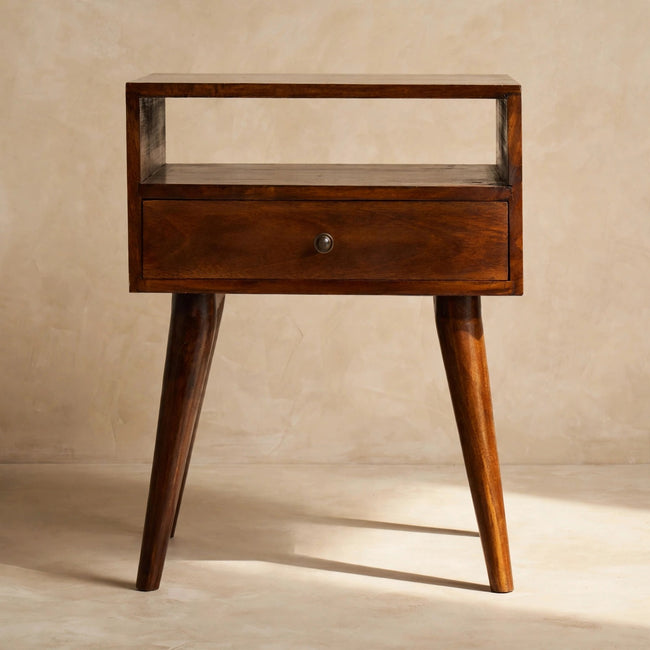 Chestnut bedside table with Scandinavian-style legs placed beside a bed