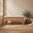 Rattan Harmony bench with handwoven rattan panel and cushioned seat in a styled room