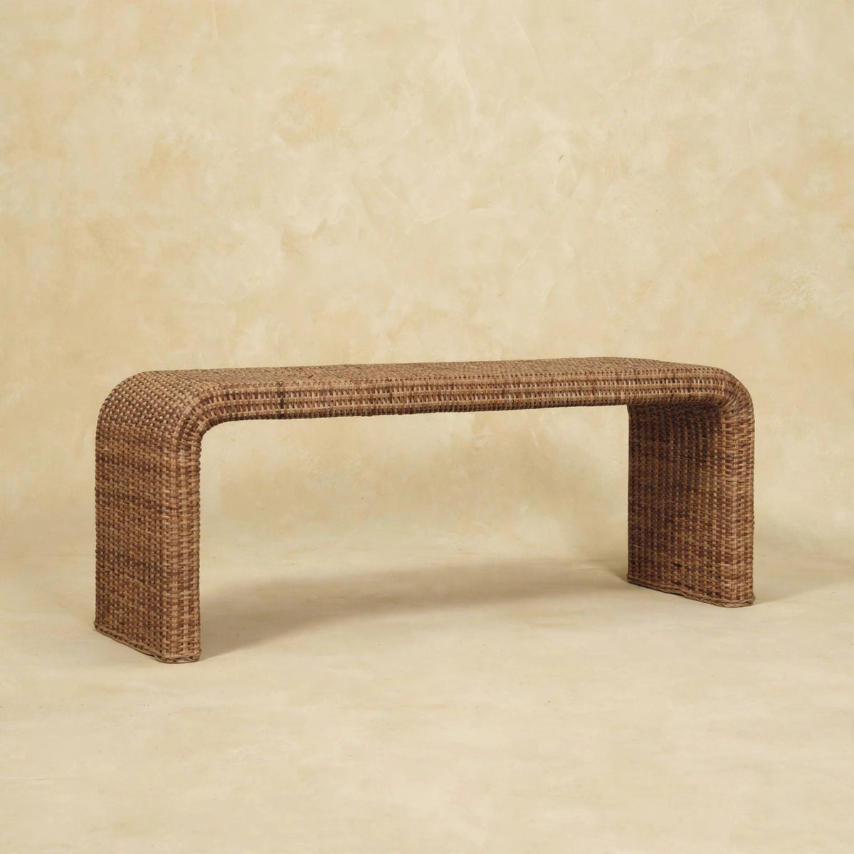 Side view of the rattan weave bench showing its mango wood frame
