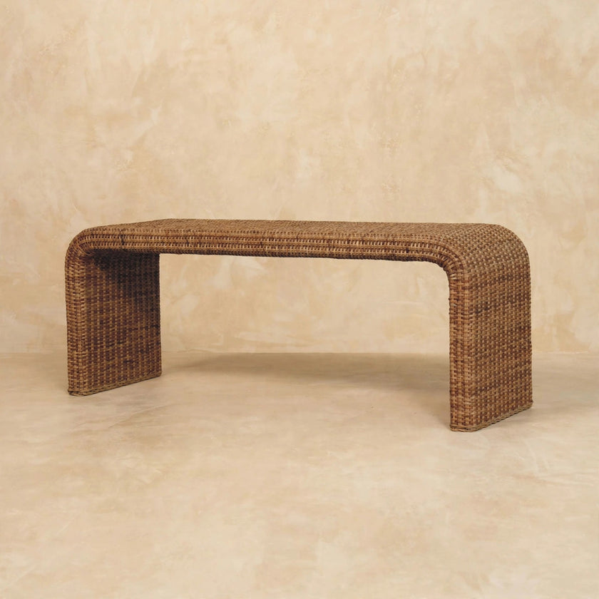 Close-up of the woven rattan detail on the mango wood bench