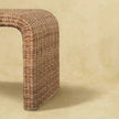 Angled view of the rattan weave bench showing its clean-lined shape