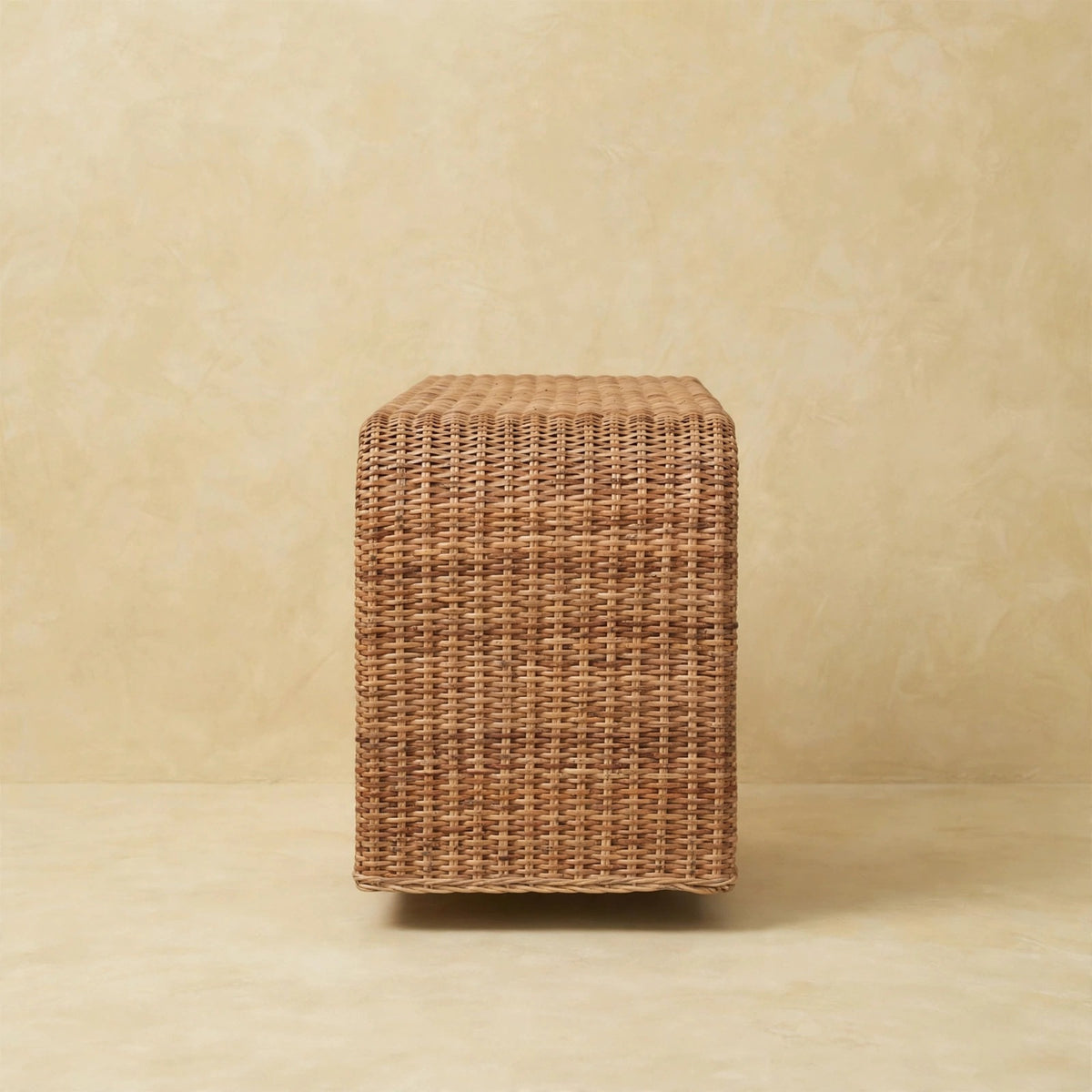 Rattan weave bench in a living space beside natural decor