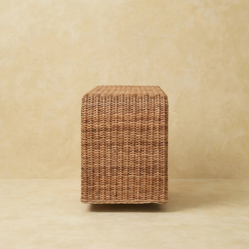 Rattan weave bench in a living space beside natural decor