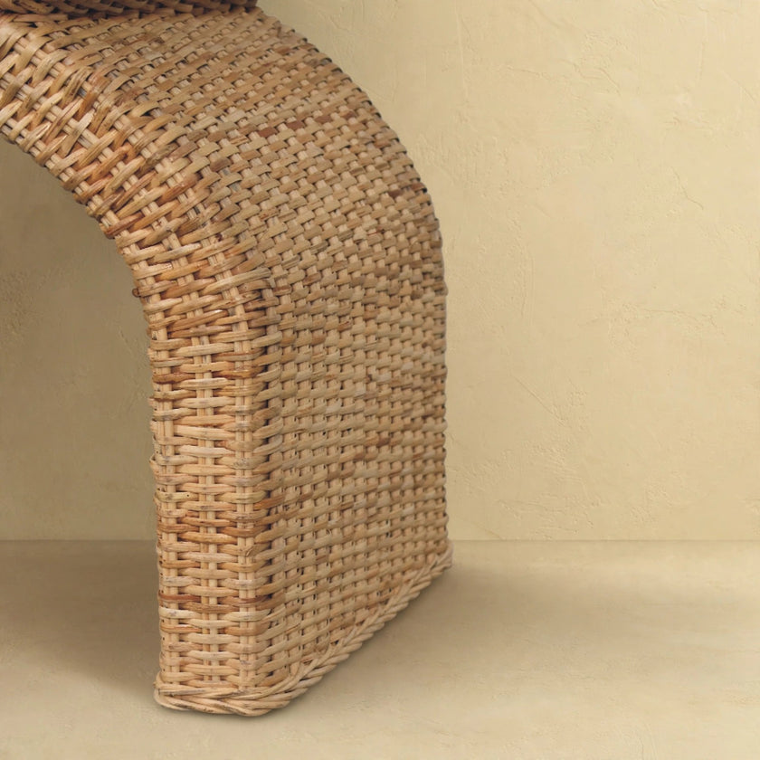 Rattan weave boucle bench with natural wood finish in a styled interior