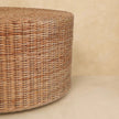 Close view of the woven exterior and circular top of the coffee table