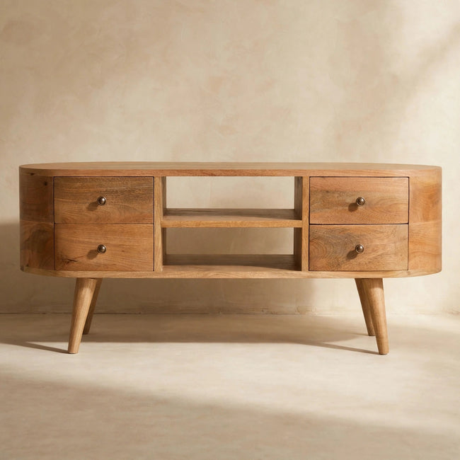 Front view of the rounded TV unit with four drawers, metal knobs and an oak-ish finish