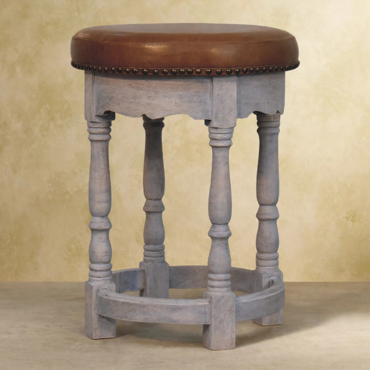 Side view of the Rustic Charm stool showing turned mango wood legs and scalloped apron