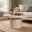 Serenity terrazzo coffee table with a pedestal base styled in a living room