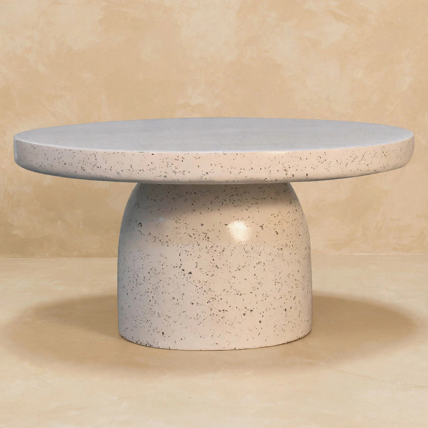 Side view of the Serenity coffee table showing its pedestal and large base