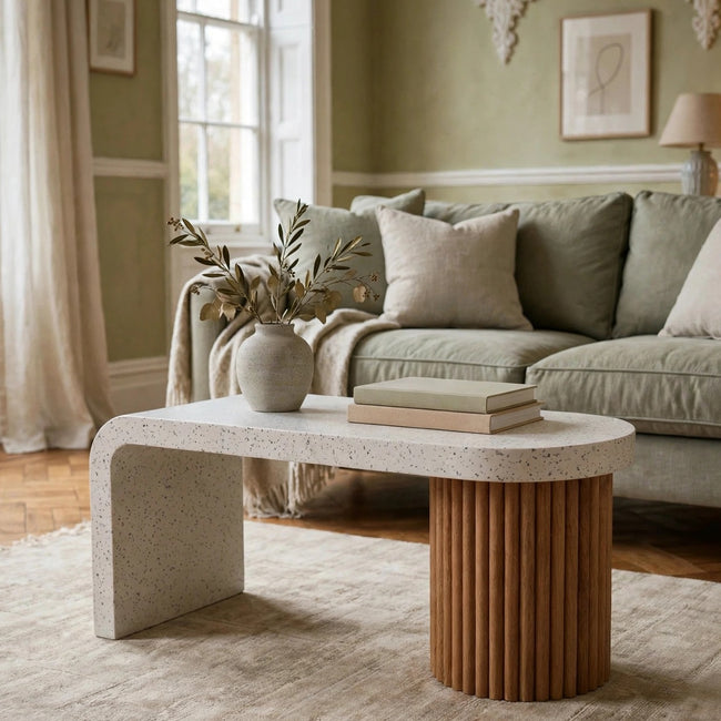 Serenity terrazzo coffee table with a white top and oak-ish mango wood base in a living room