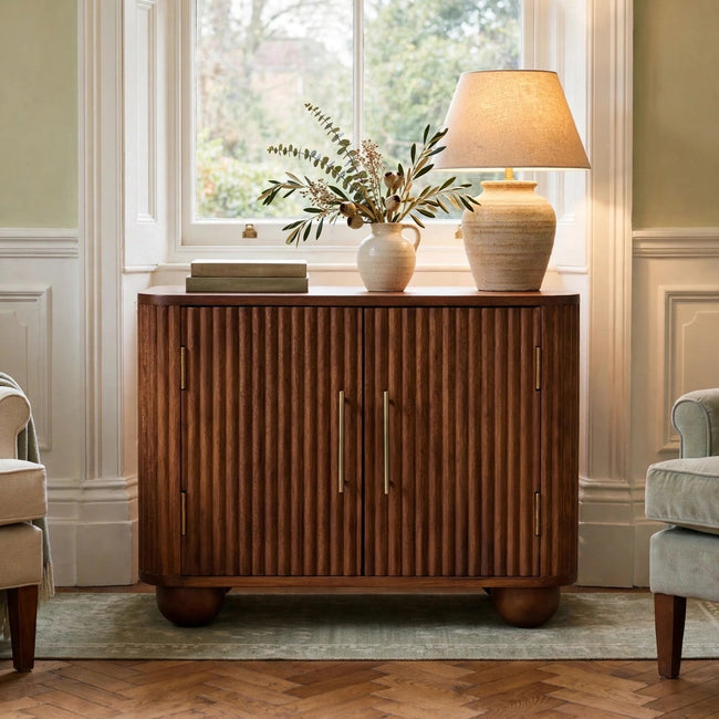 Solis fluted mini sideboard in Amber Oak finish styled in a living room