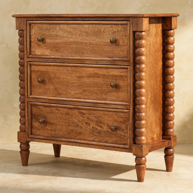 Solid mango wood Spindle chest of drawers with carved spindle legs in a room setting