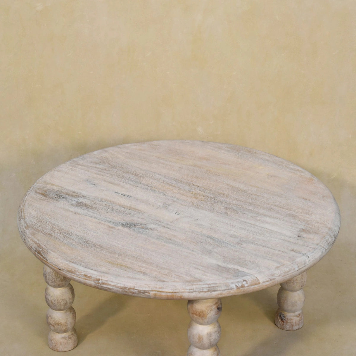 Close view of the rounded tabletop and wood grain on the Salted Oak coffee table