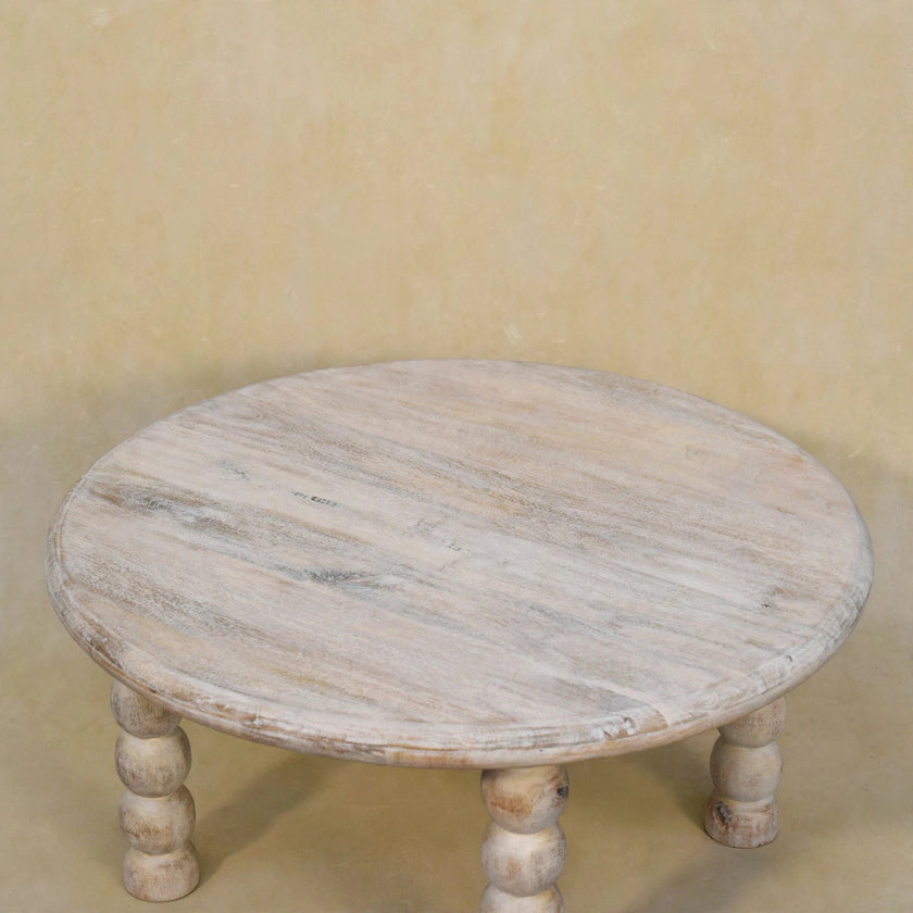 Close view of the rounded tabletop and wood grain on the Salted Oak coffee table