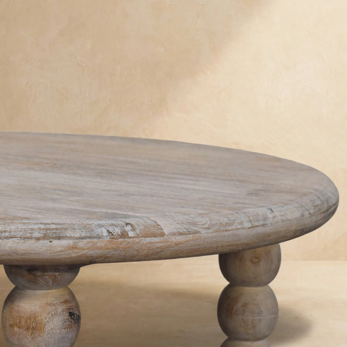 Turned spindle legs of the Salted Oak coffee table in a styled room