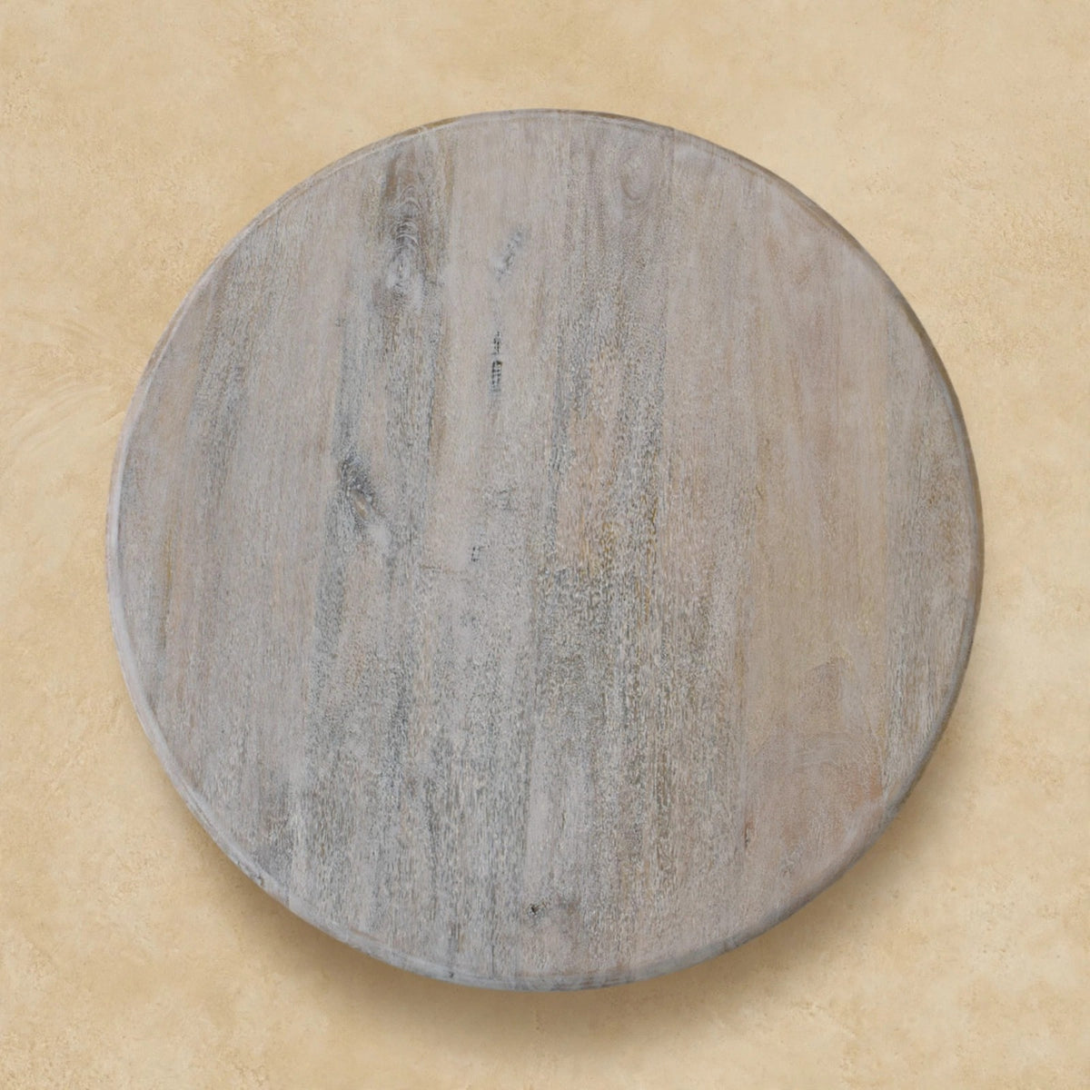 Side angle of the Salted Oak coffee table showing its spindle legs and rounded top