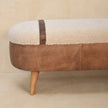 Side view of the tan boucle bench with Nordic-style legs