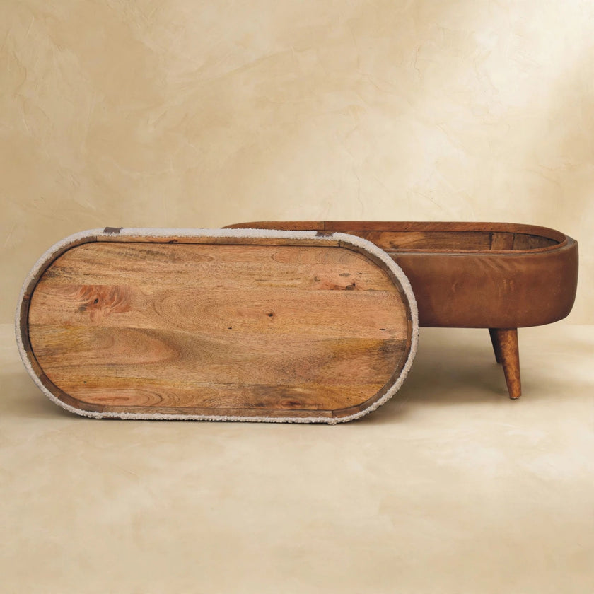 Tan bench with boucle seat and oak-look legs in a styled room