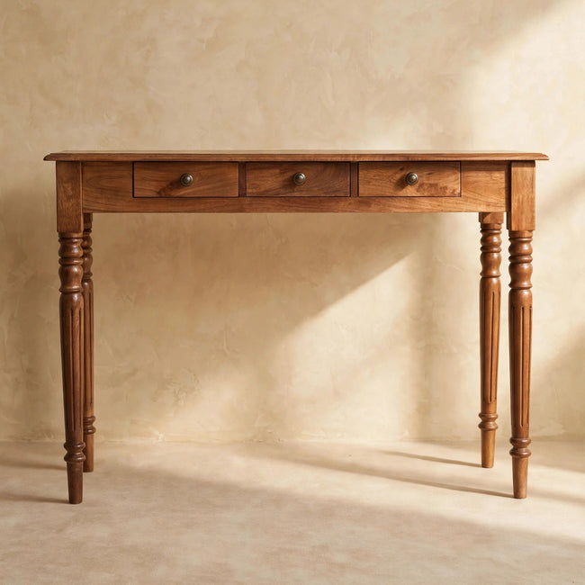 Front view of the mango wood console table with three drawers and a slim rectangular top