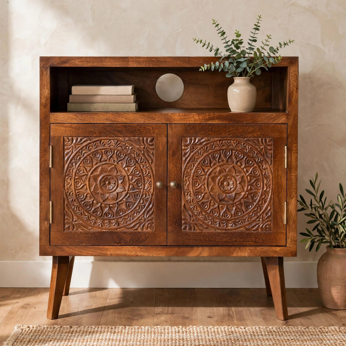 Tova open shelf cabinet in solid mango wood styled in a living room