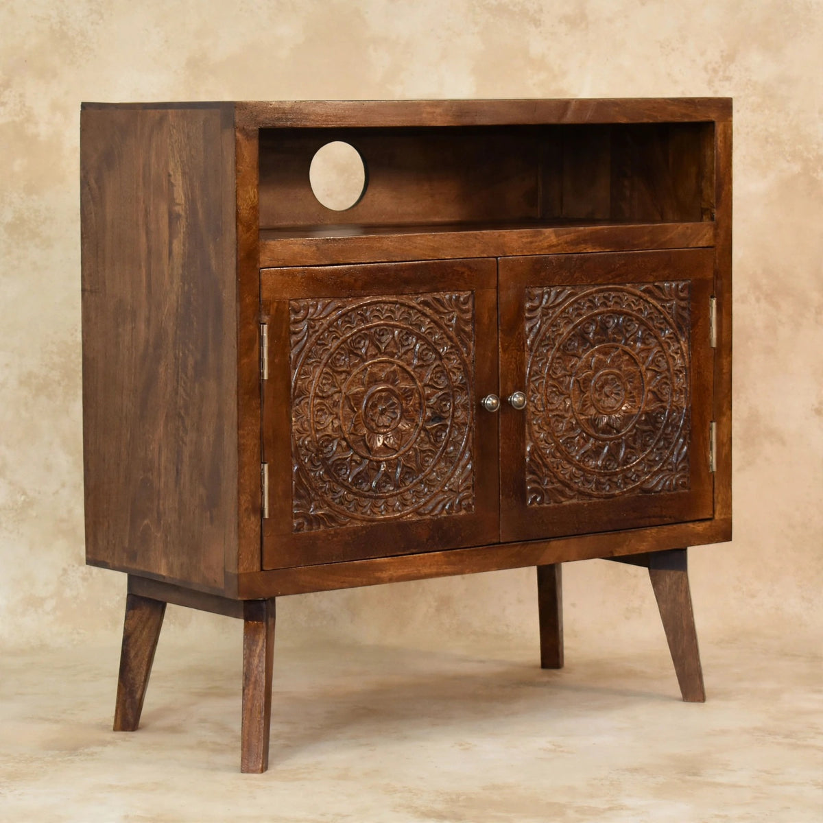 Tova mango wood cabinet with a chestnut finish in a living room setting