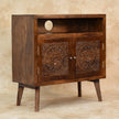 Tova mango wood cabinet with a chestnut finish in a living room setting