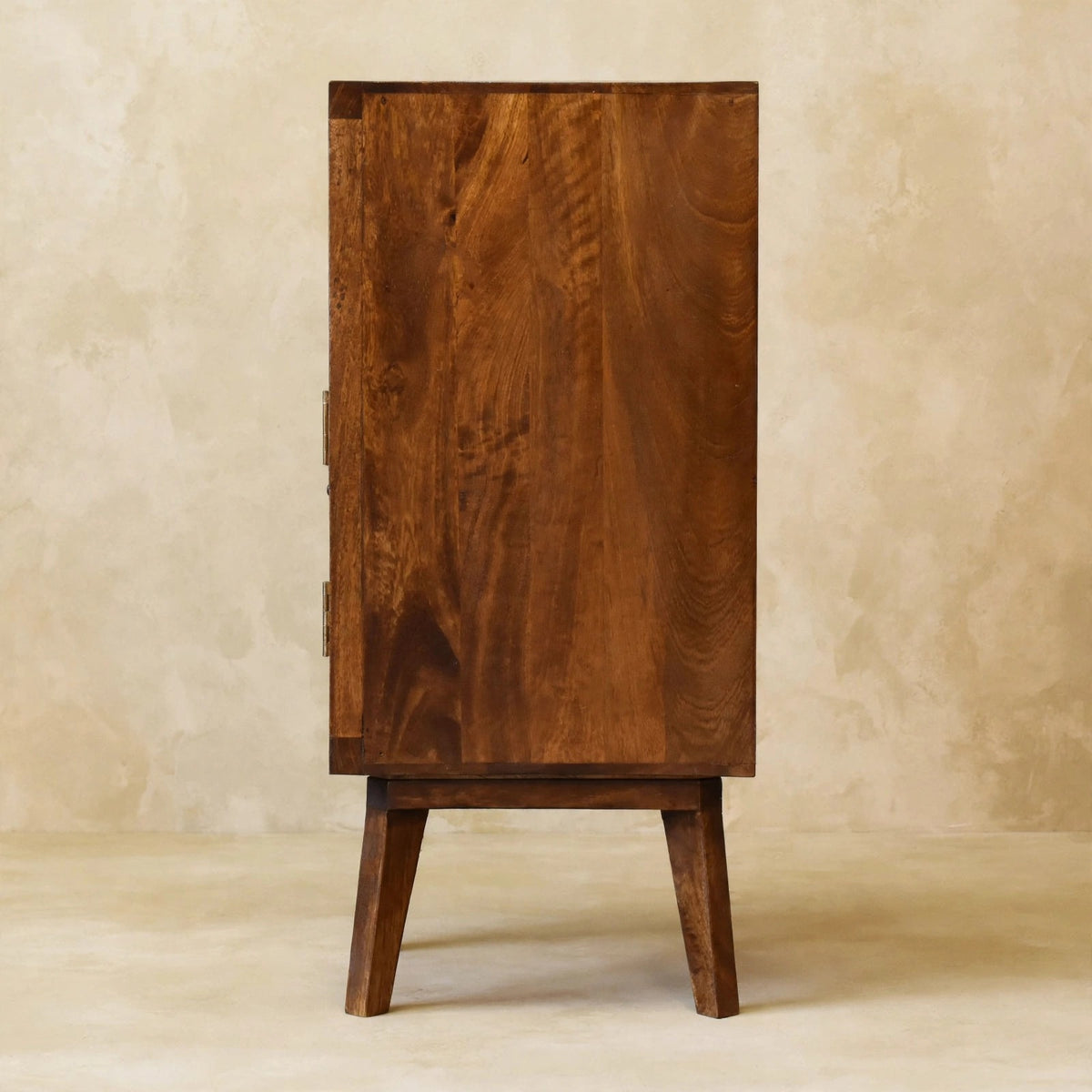 Side view of the Tova open shelf cabinet in a styled room