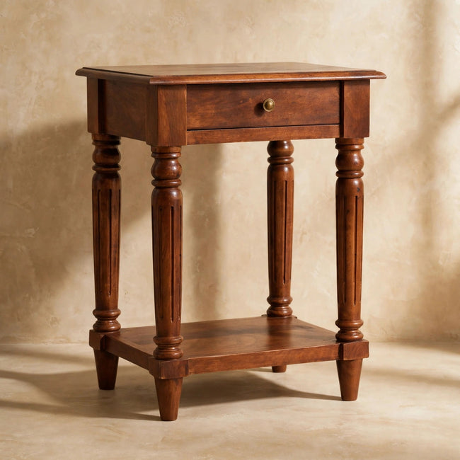 Side table with brass drawer knob and lower shelf styled in a living space