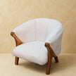 Oak-ish finish solid mango wood legs of the white boucle chair